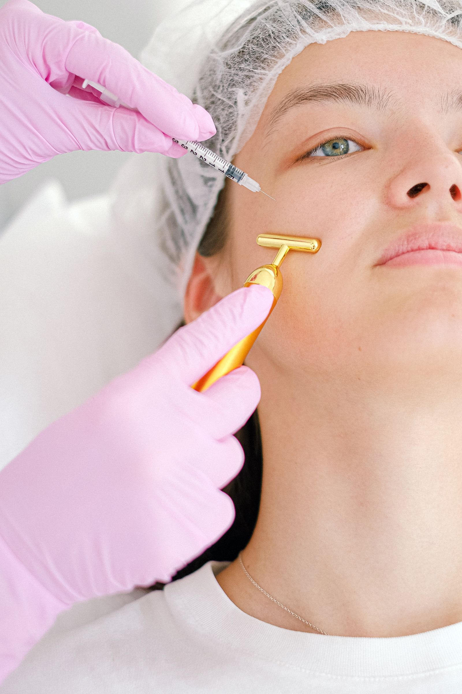 Aesthetician performing a relaxing facial treatment