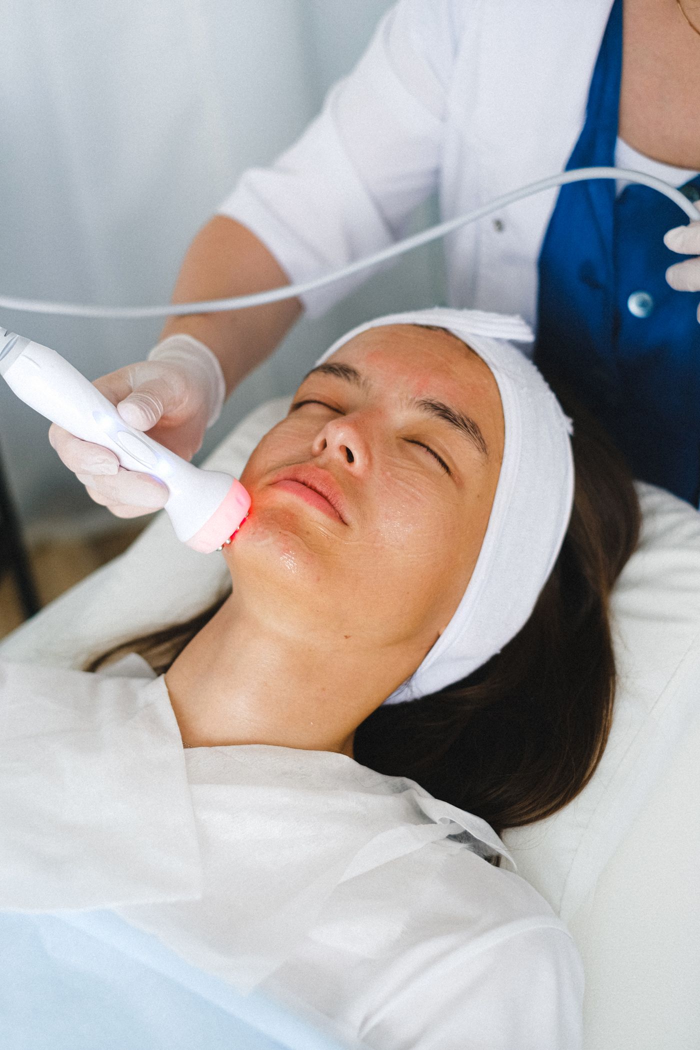 Aesthetician performing an advanced facial treatment