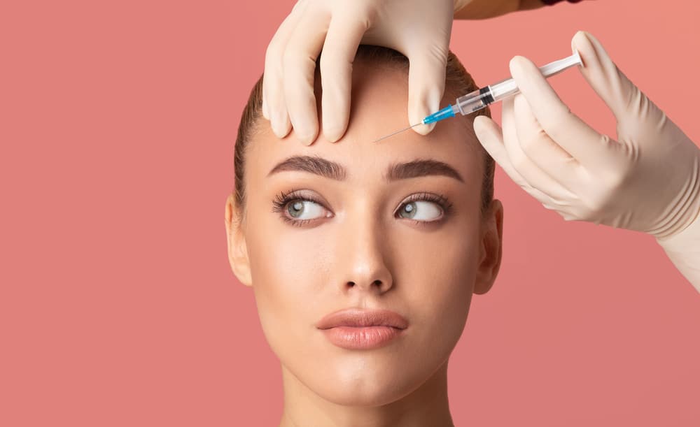 A woman getting BOTOX Cosmetic in her forehead